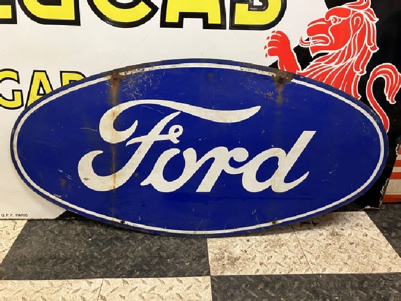 Double sided oval Ford dealership tin sign