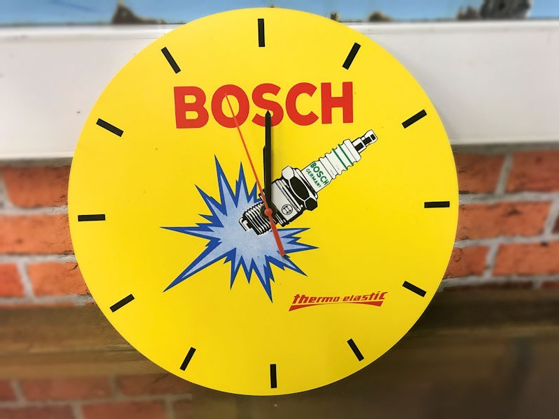 Plastic round Bosch spark plug battery operated clock