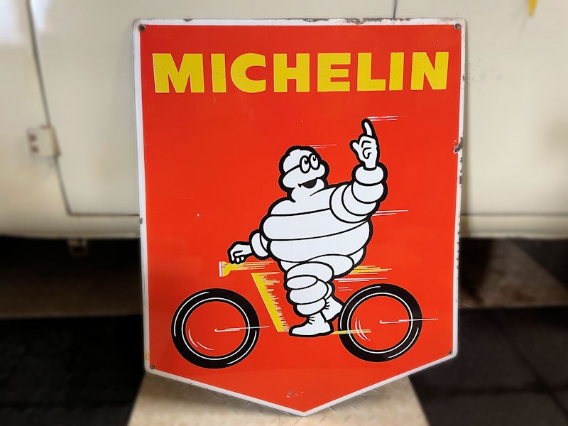 Original enamel Michelin Bibendum motor cyclist sign