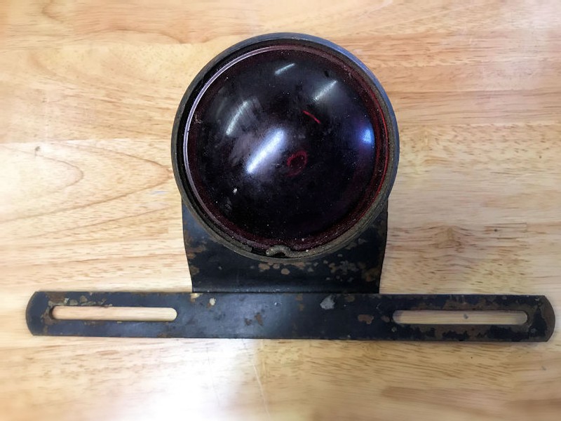 Original vintage stop and tail light with licence plate holder